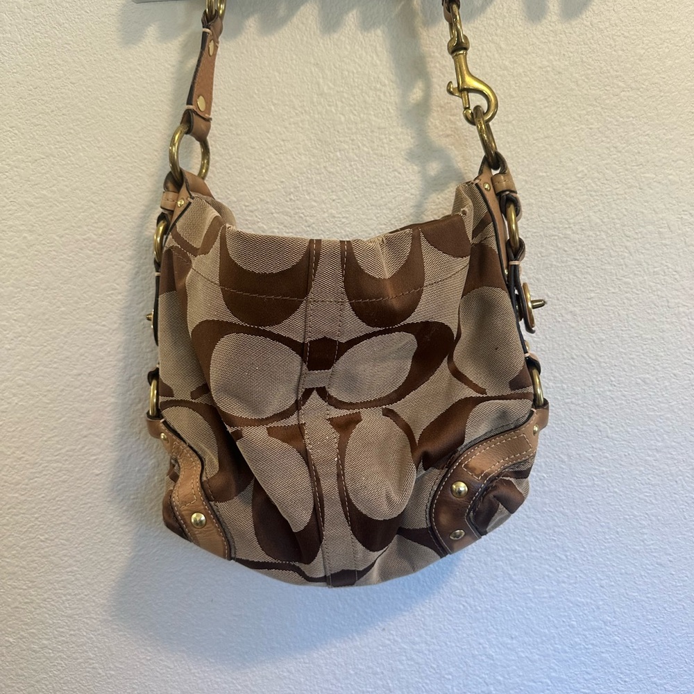 Coach over the shoulder bag. Great condition and clean. Purple inside.